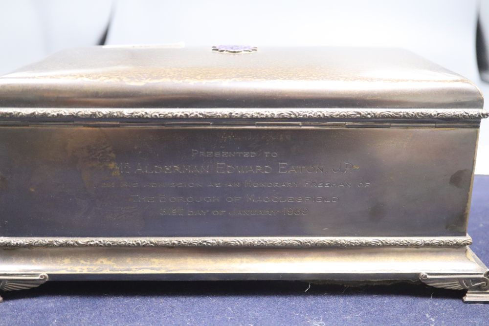 A George VI silver rectangular presentation casket, with enamelled appliques, in a blue leather box